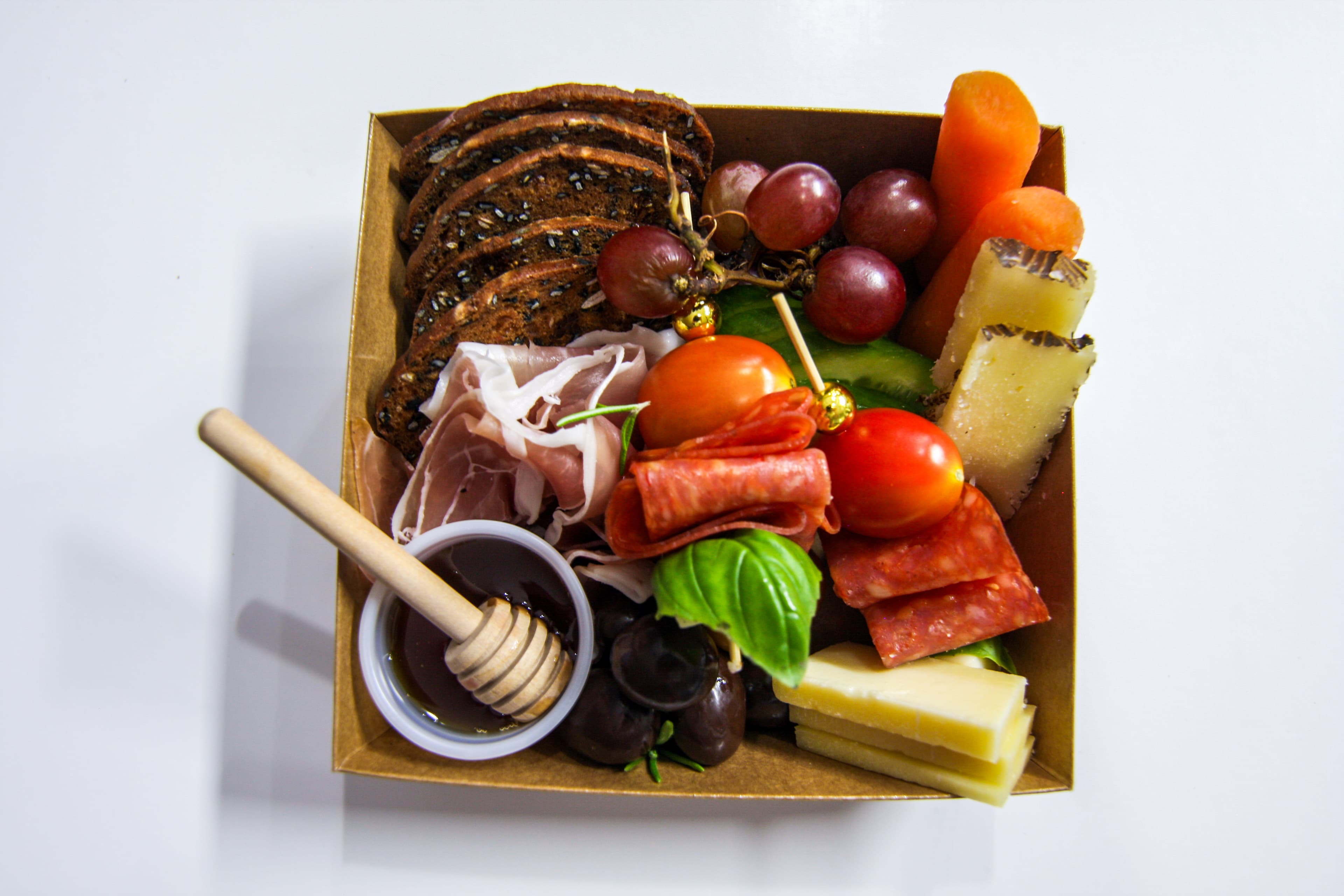 Our founder crafting a charcuterie board